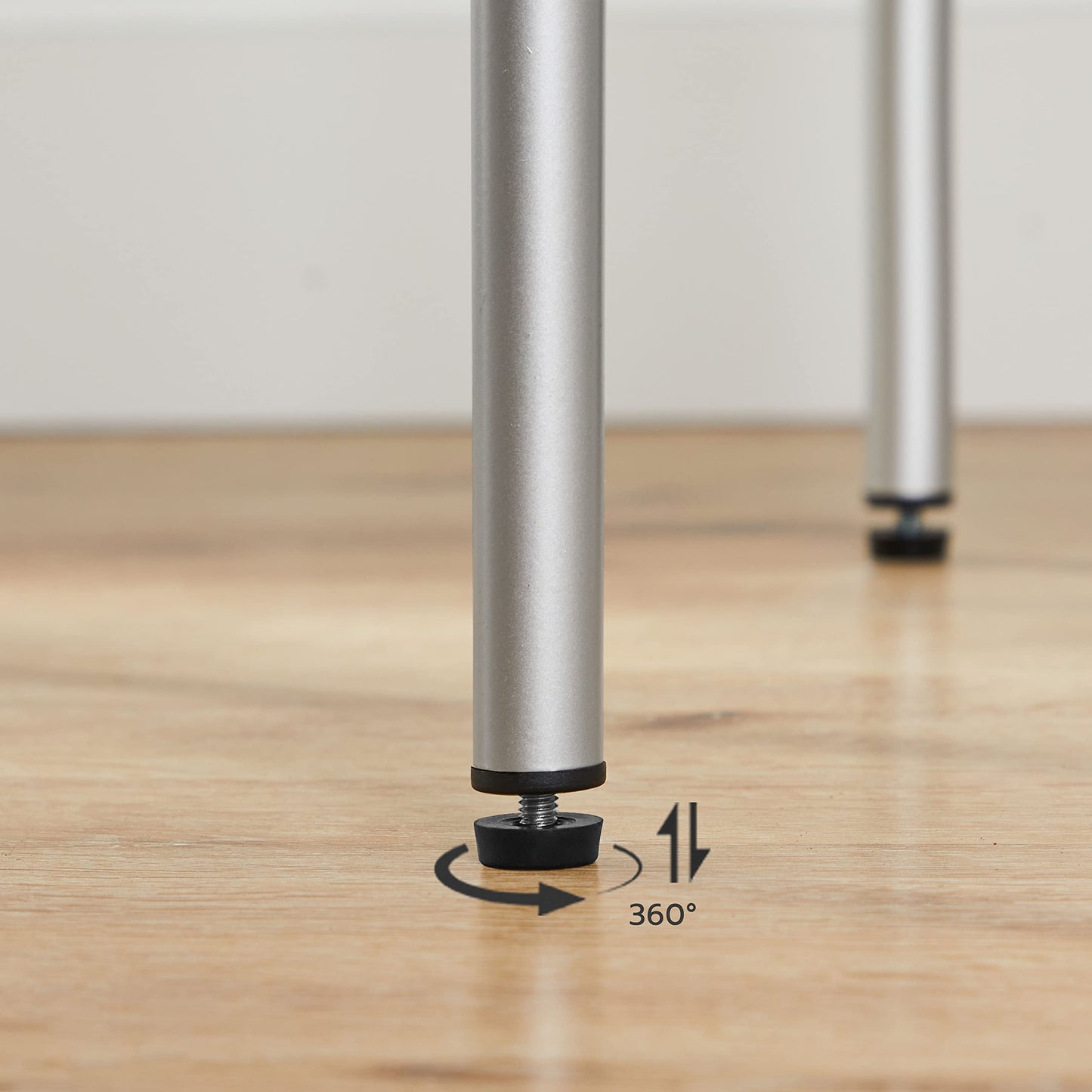 Metal leg with a 360-degree swivel mechanism on a wooden floor.