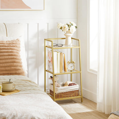 Gold side table with decorative items in a bedroom setting