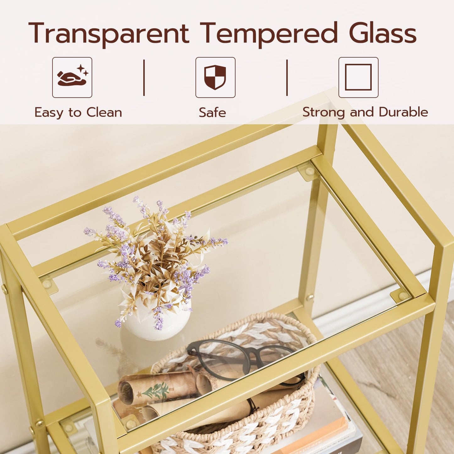 Gold-framed glass table with decorative items on a light background, featuring text on transparent tempered glass.