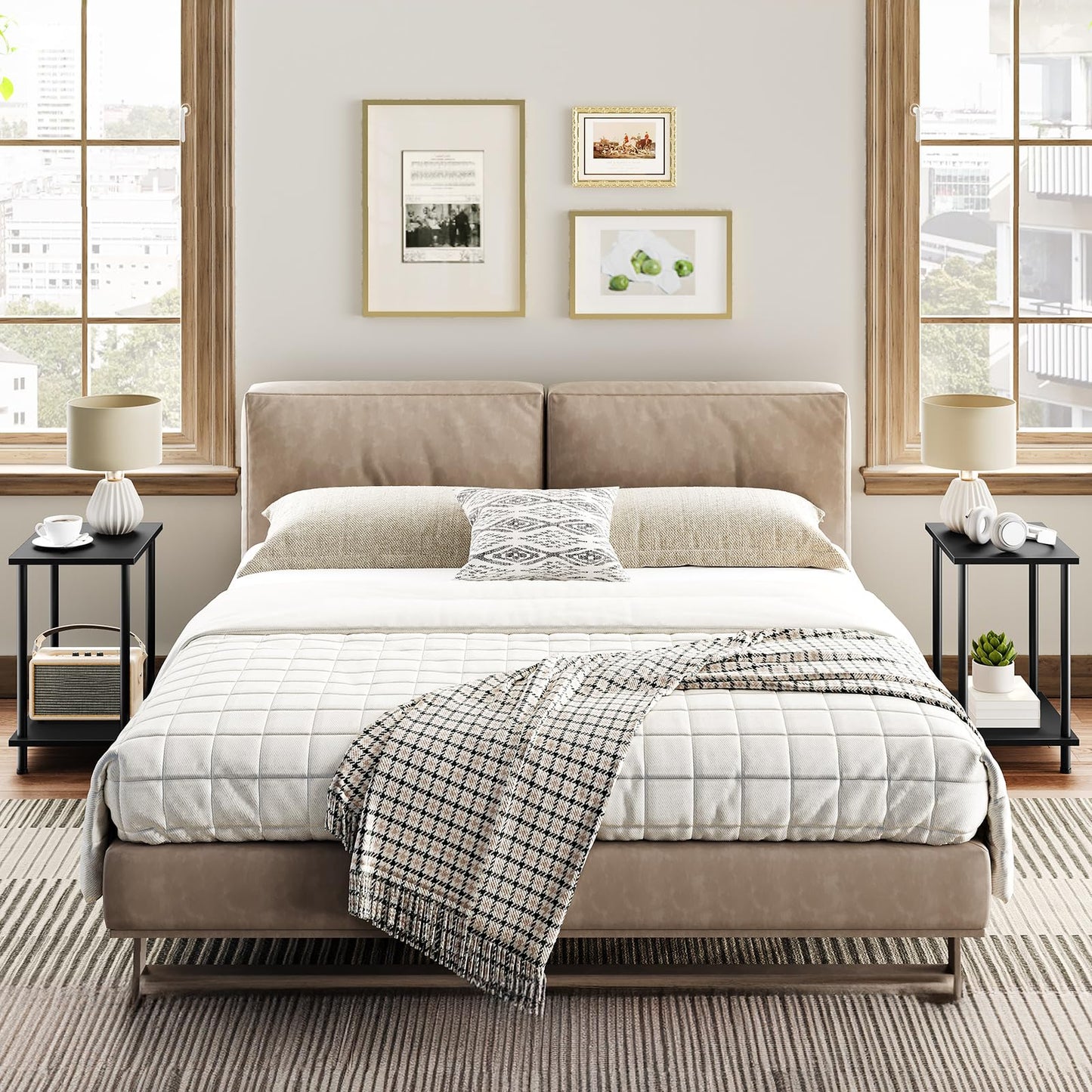 Neatly made bed in a bedroom with side tables and framed pictures on the wall.