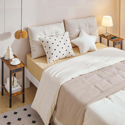 Neatly made bed with decorative pillows in a bedroom setting.