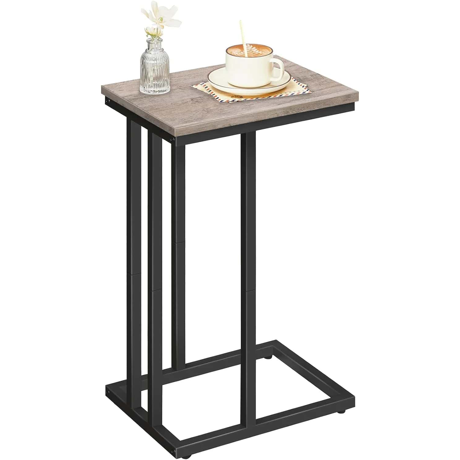 Small side table with a cup of coffee and a vase on a white background