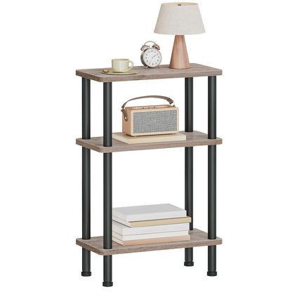 Three-tiered wooden shelf with decorative items on a white background