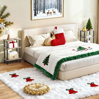 Decorated bedroom with Christmas-themed bedding and stockings, featuring a winter landscape painting on the wall.