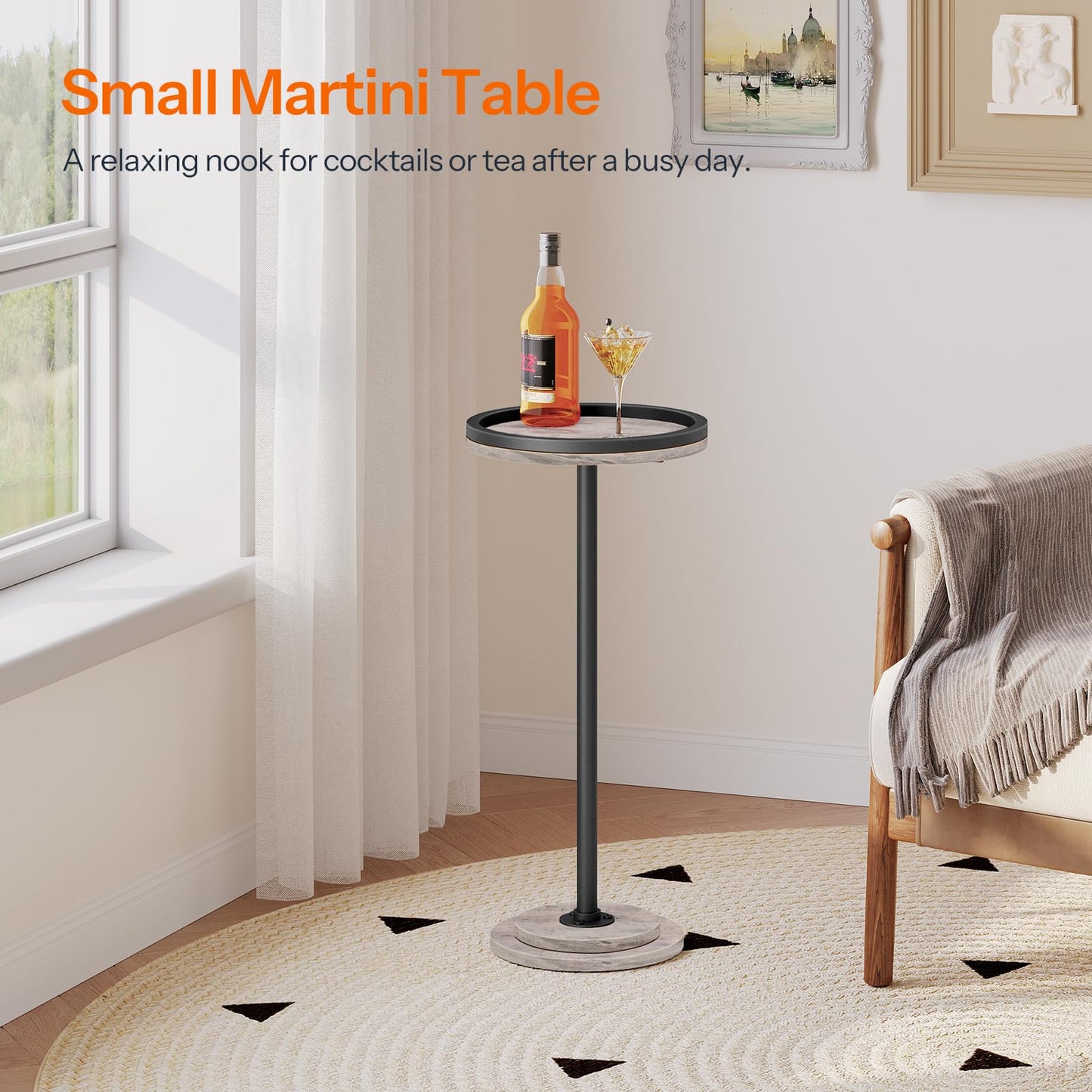 Small martini table with a bottle and glass in a room setting.