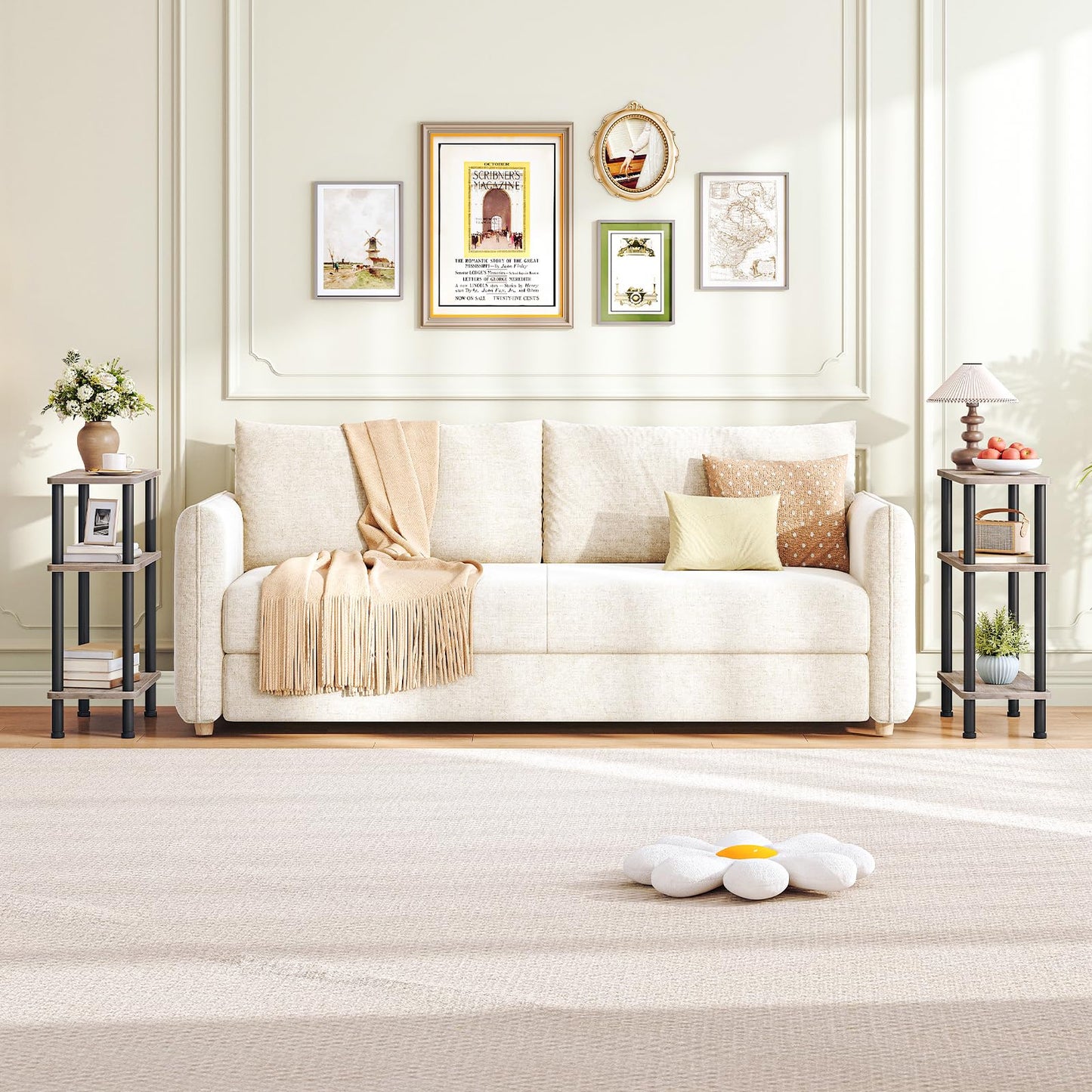 Living room with a white sofa, decorative pillows, and framed pictures on the wall.
