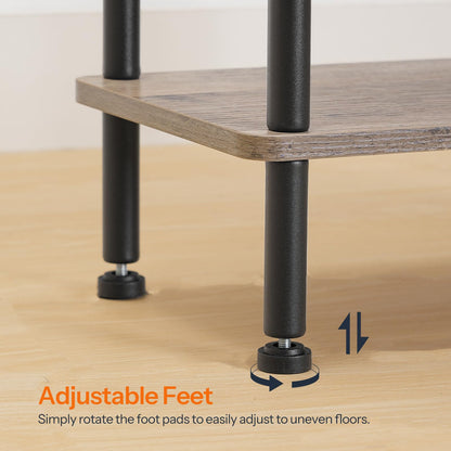 Wooden table with adjustable feet on a wooden floor