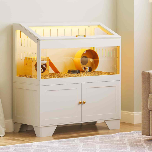 White pet cage with a light interior, containing a hamster and wheel, on a wooden floor.