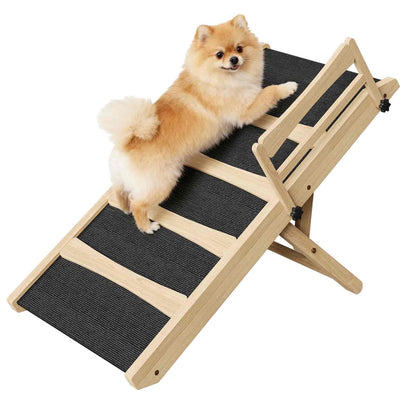 Small dog climbing a wooden pet ramp with black textured steps on a white background