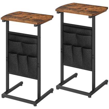 Two wooden tables with black storage bags on a white background