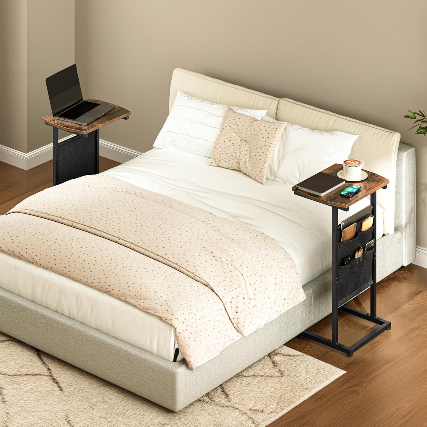 Beige bed with two side tables, one with a laptop and the other with books and a cup.