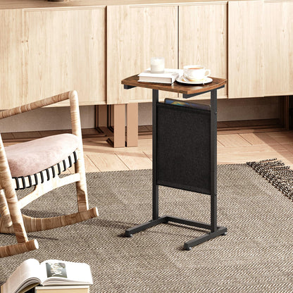 Small wooden table with a black stand in a room with wooden cabinets and a chair.