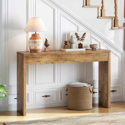 Wooden console table with decorative items against a white wall.