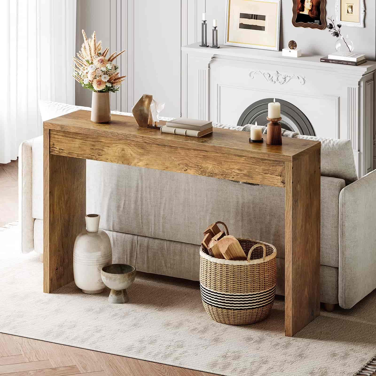 Wooden console table in a living room with decorative items.