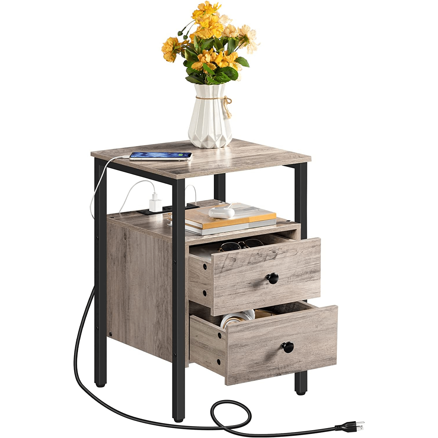 Side table with two drawers, a vase of flowers, and electronic devices on a white background