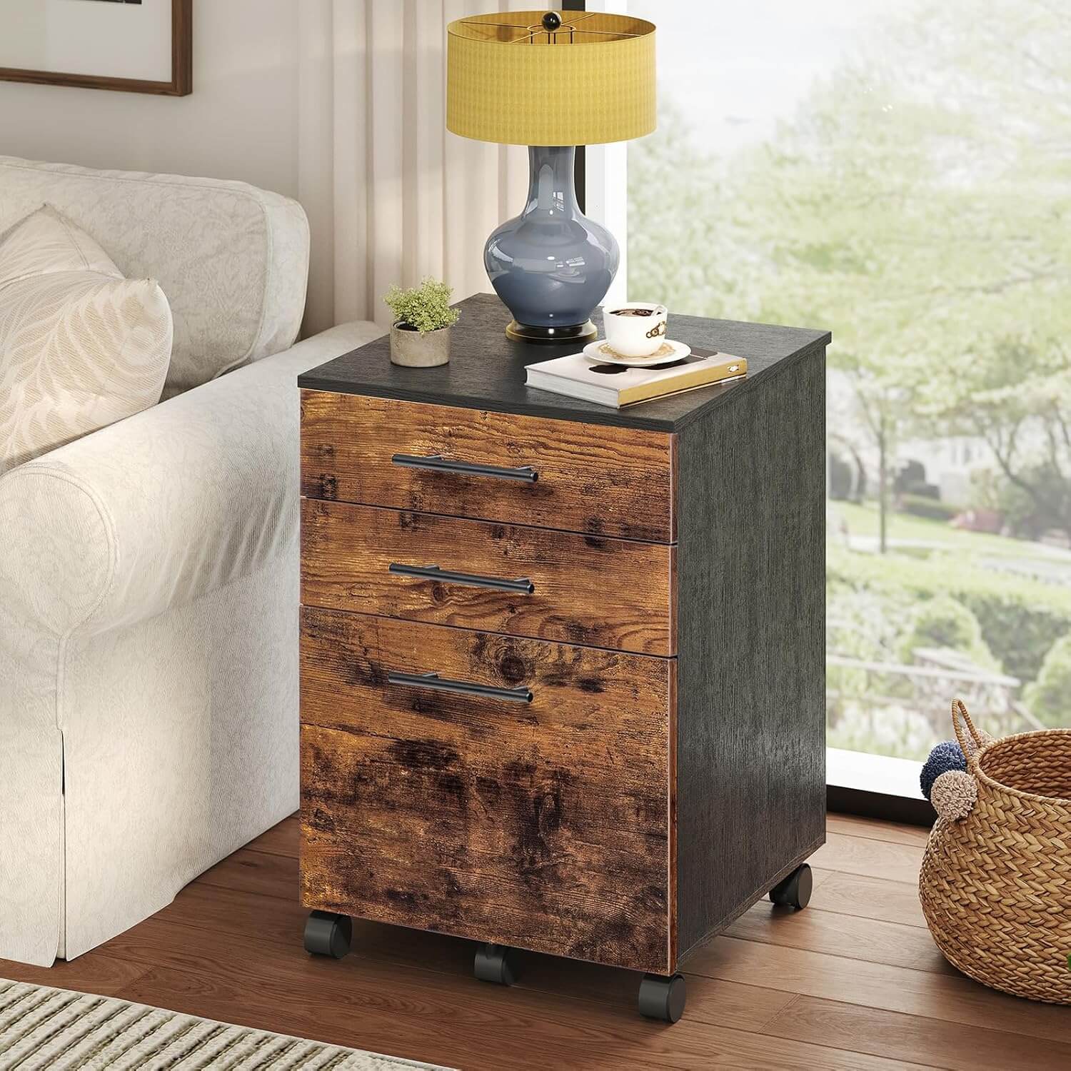 Wooden side table with three drawers in a living room setting.