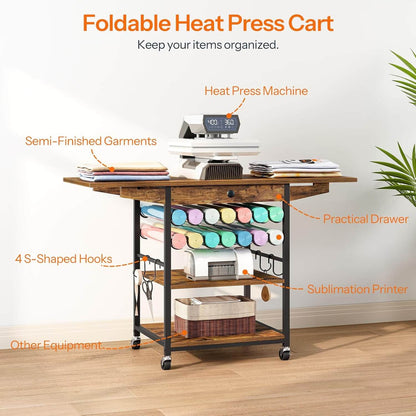 Foldable heat press cart with various equipment on a wooden floor.