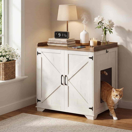 White cabinet with a cat door in a room with a lamp, books, and flowers.
