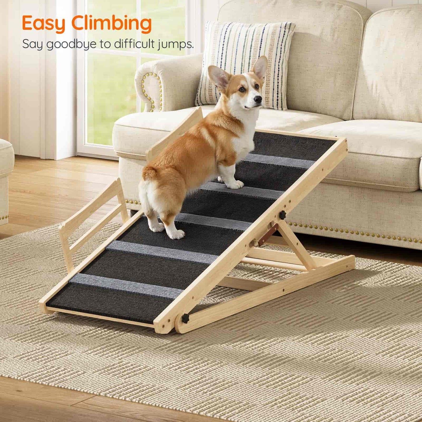 Dog using a set of pet stairs in a living room.