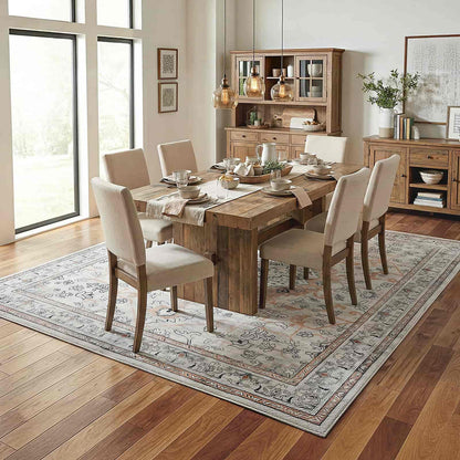 Dining room with wooden table and chairs on a patterned rug