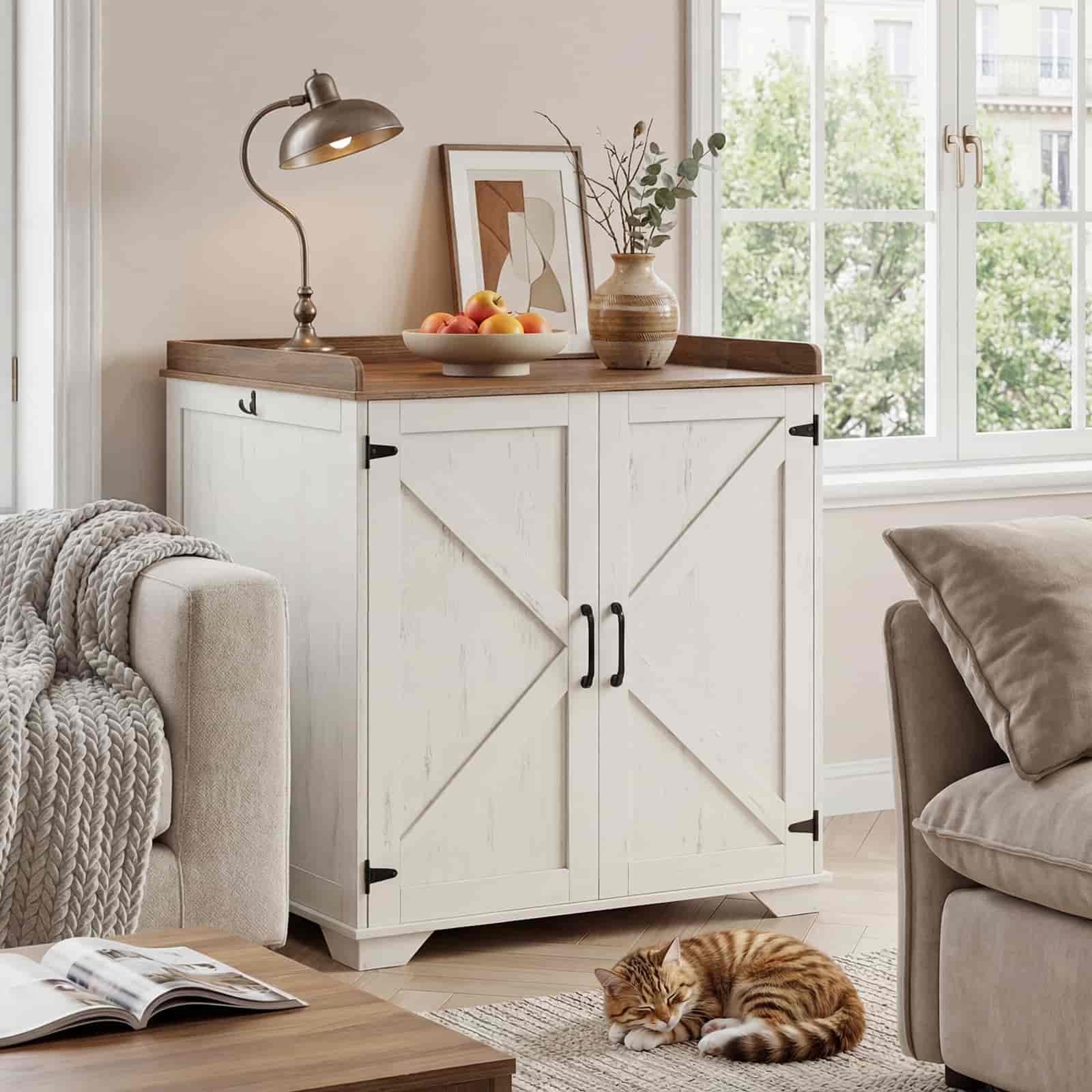 White sideboard with wooden top in a living room setting with a cat resting on the floor.