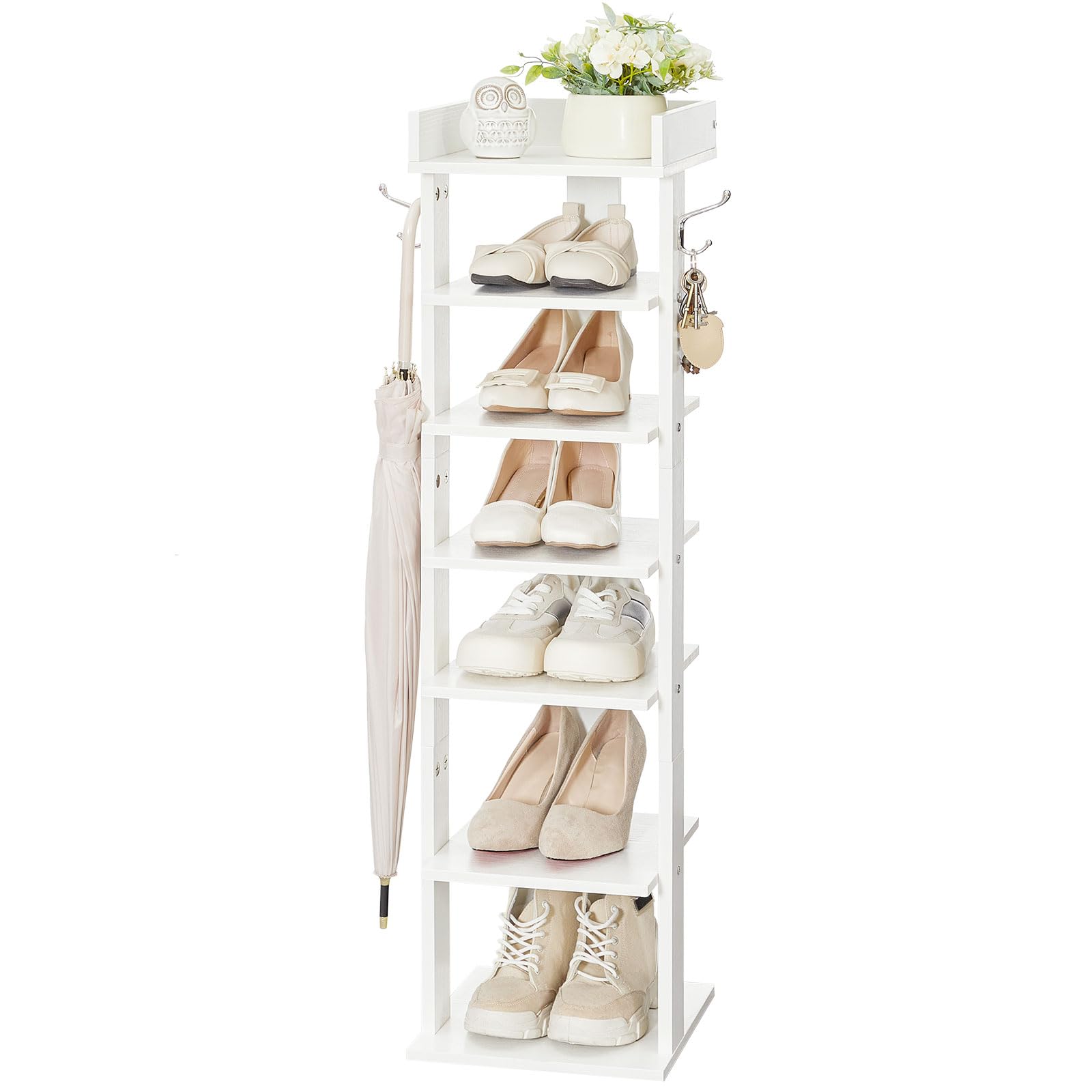 White shoe rack with shoes, an umbrella, and a plant on a white background