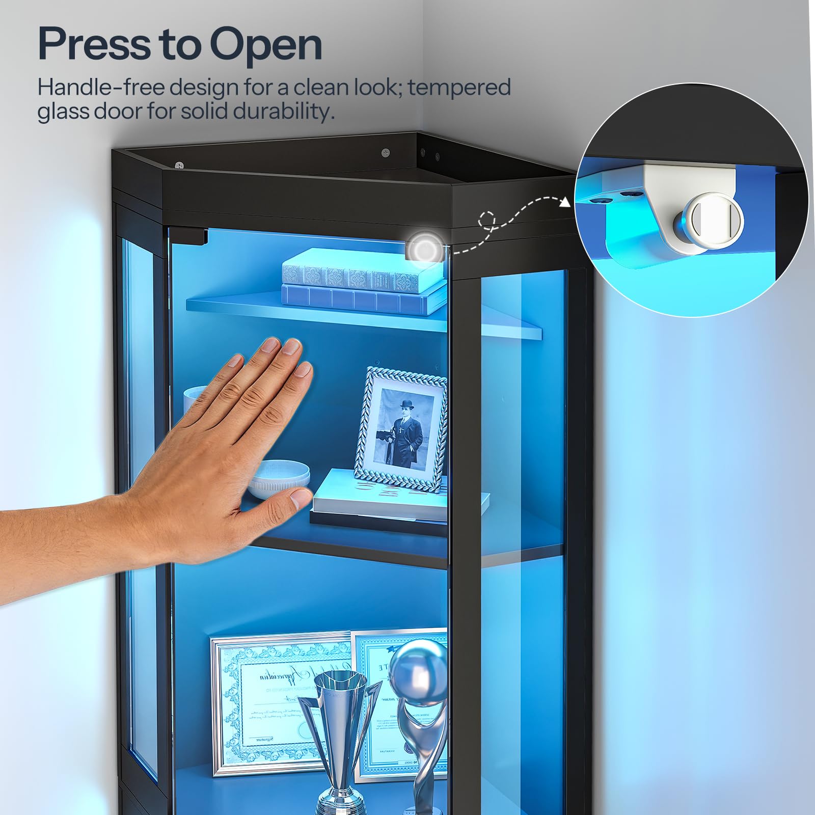 Glass display cabinet with handle-free design and hand pressing a button to open the door.