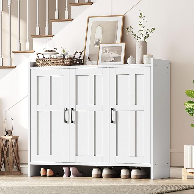 White storage cabinet with shoes underneath in a home setting