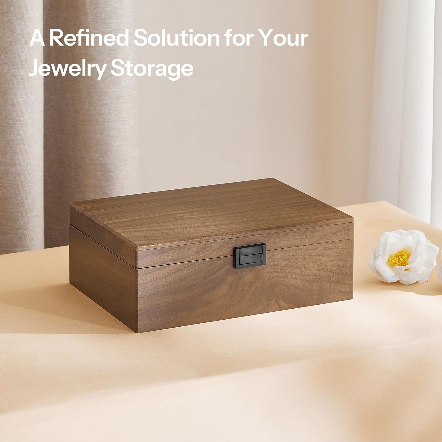 Wooden jewelry box on a light surface with a neutral background