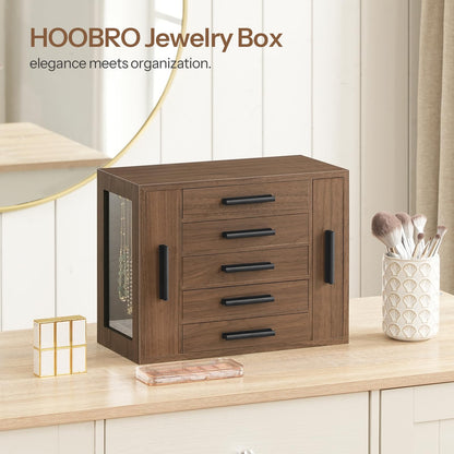 Wooden jewelry box with drawers on a wooden surface, featuring the brand 'HOOBRO'.