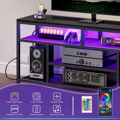 Black entertainment console with LED lighting, speakers, and electronic devices.