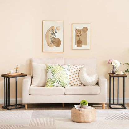 Living room with a beige sofa, decorative pillows, and wall art.