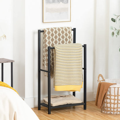 Towel rack with patterned towels in a room setting