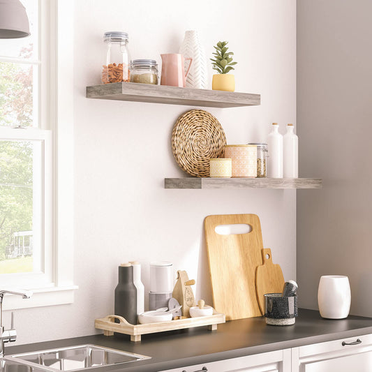 Modern kitchen with shelves, cutting boards, and decor items.
