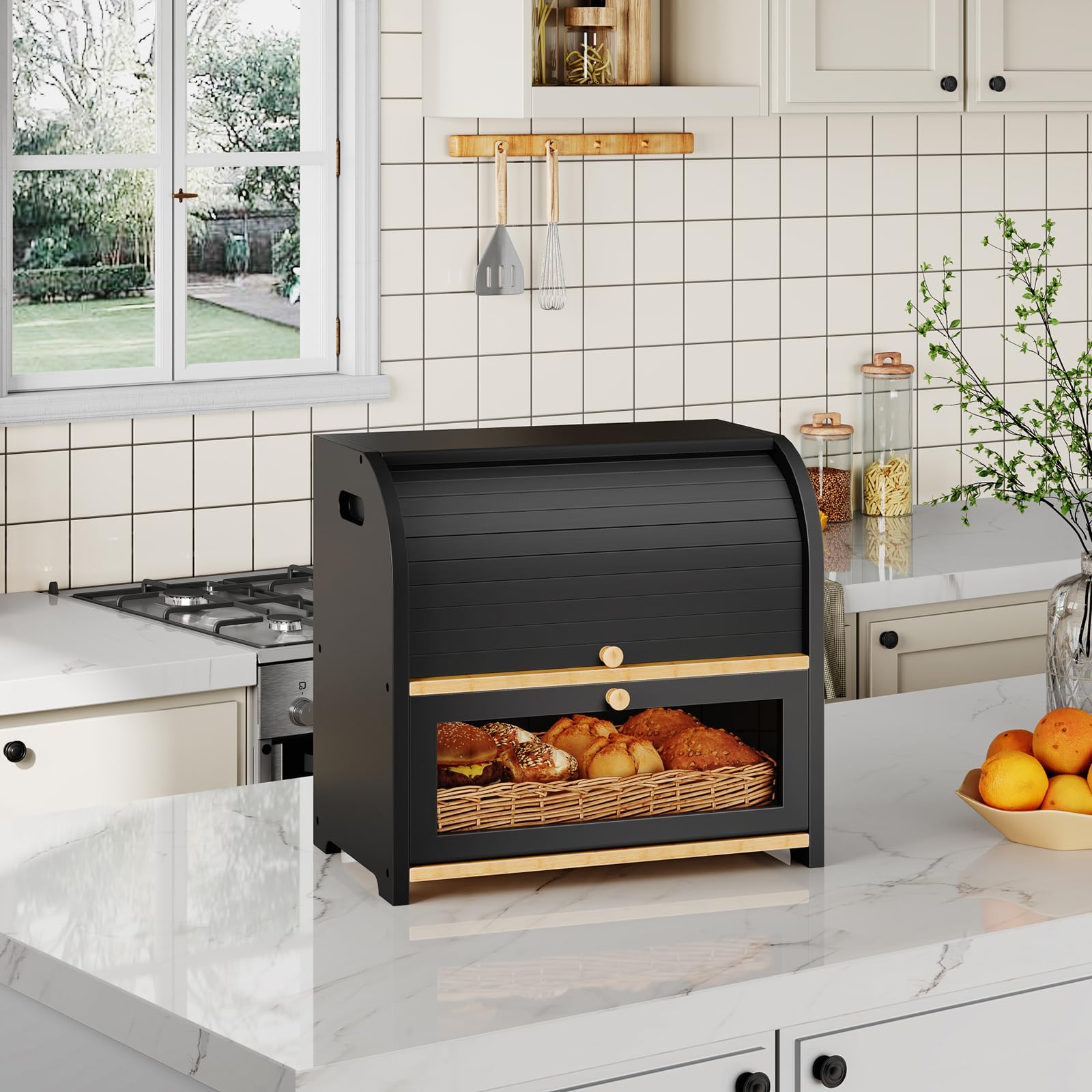 Black roll-top bread box with bread inside on a kitchen counter.
