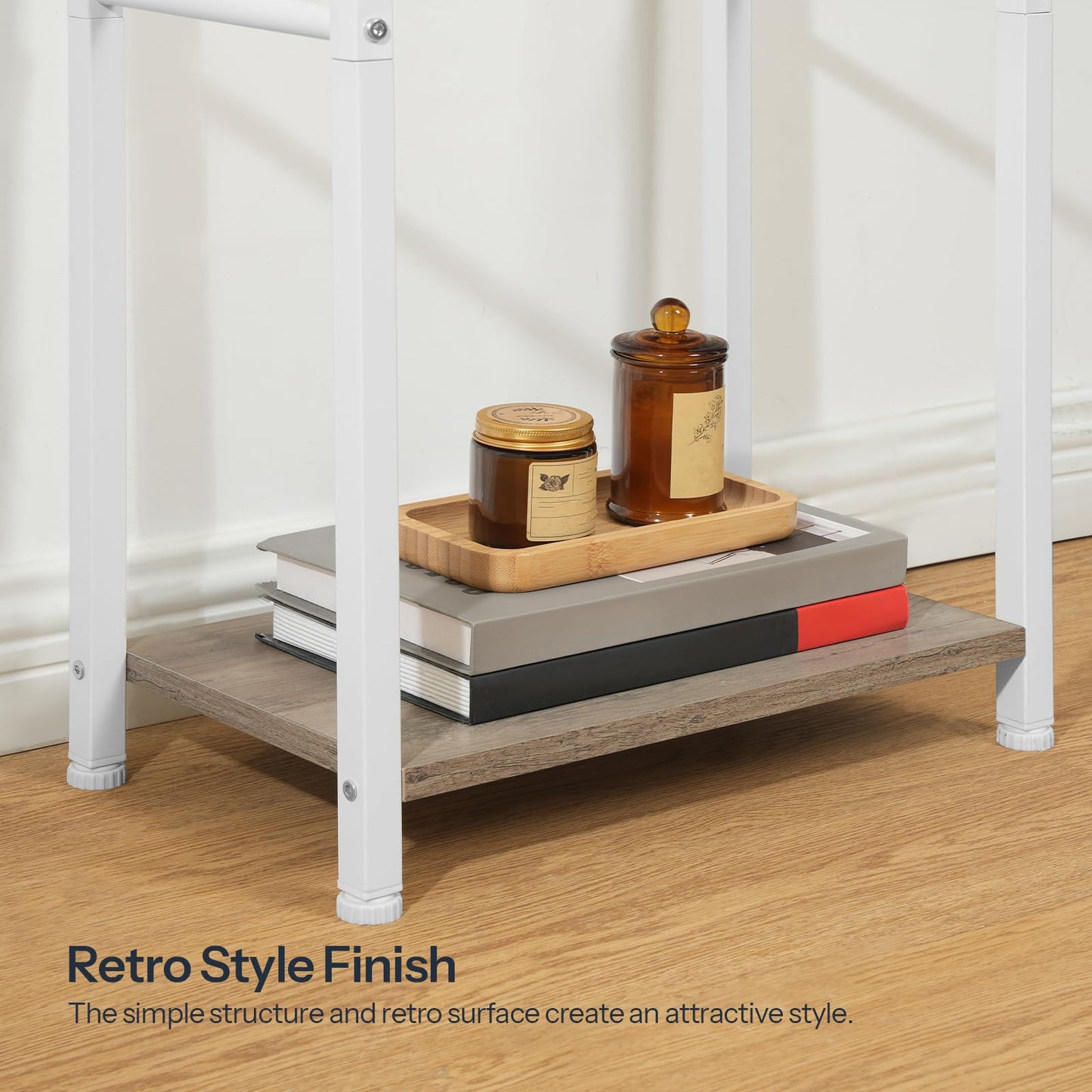 Retro-style shelf with books and candles on a wooden floor.
