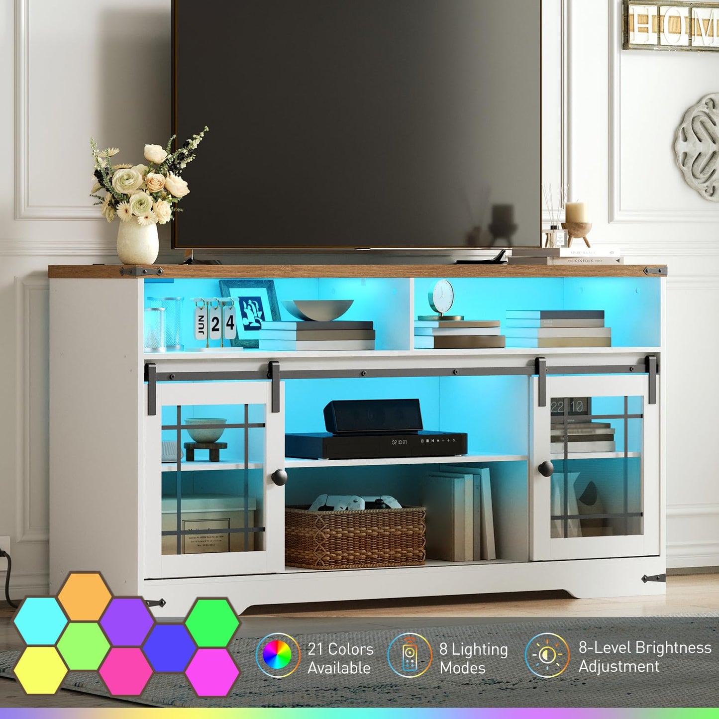 Modern entertainment console with glass doors and LED lighting in a living room setting.