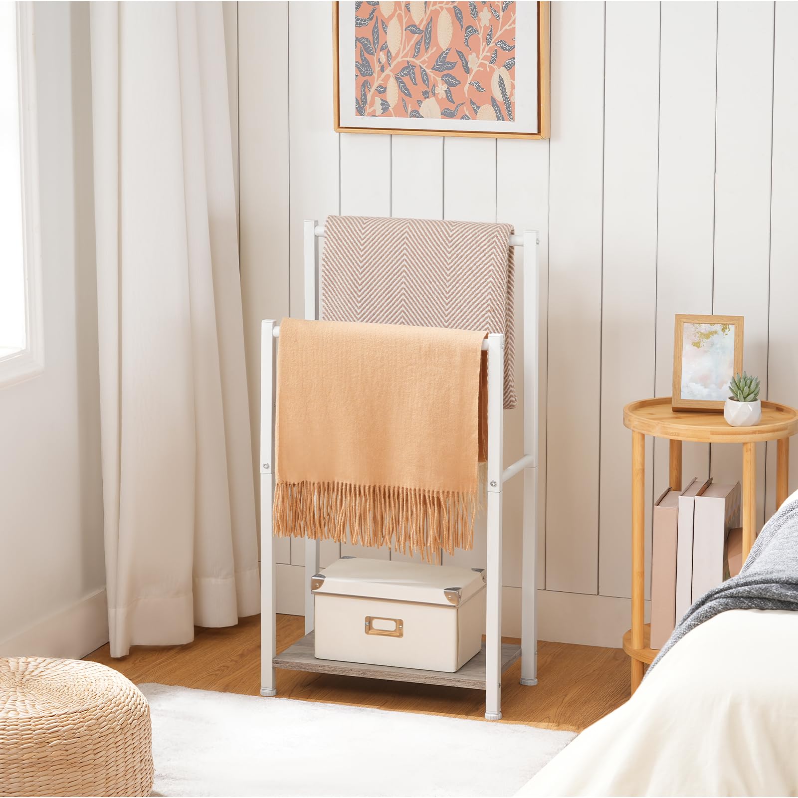 Towel rack with folded towels in a bedroom setting
