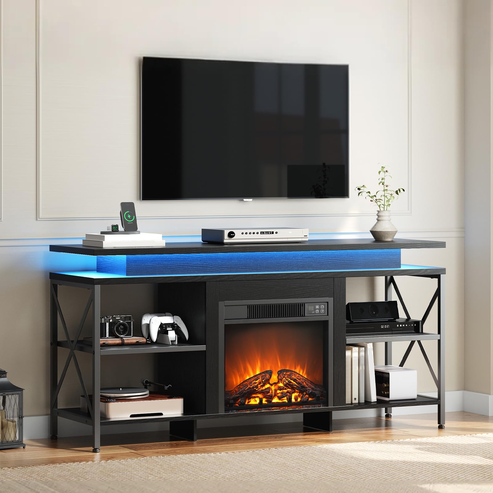 Modern living room with a TV on a black entertainment console featuring an electric fireplace.