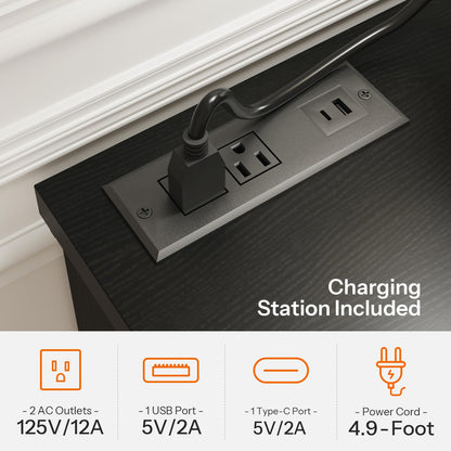 Charging station with power outlets and USB ports on a desk.