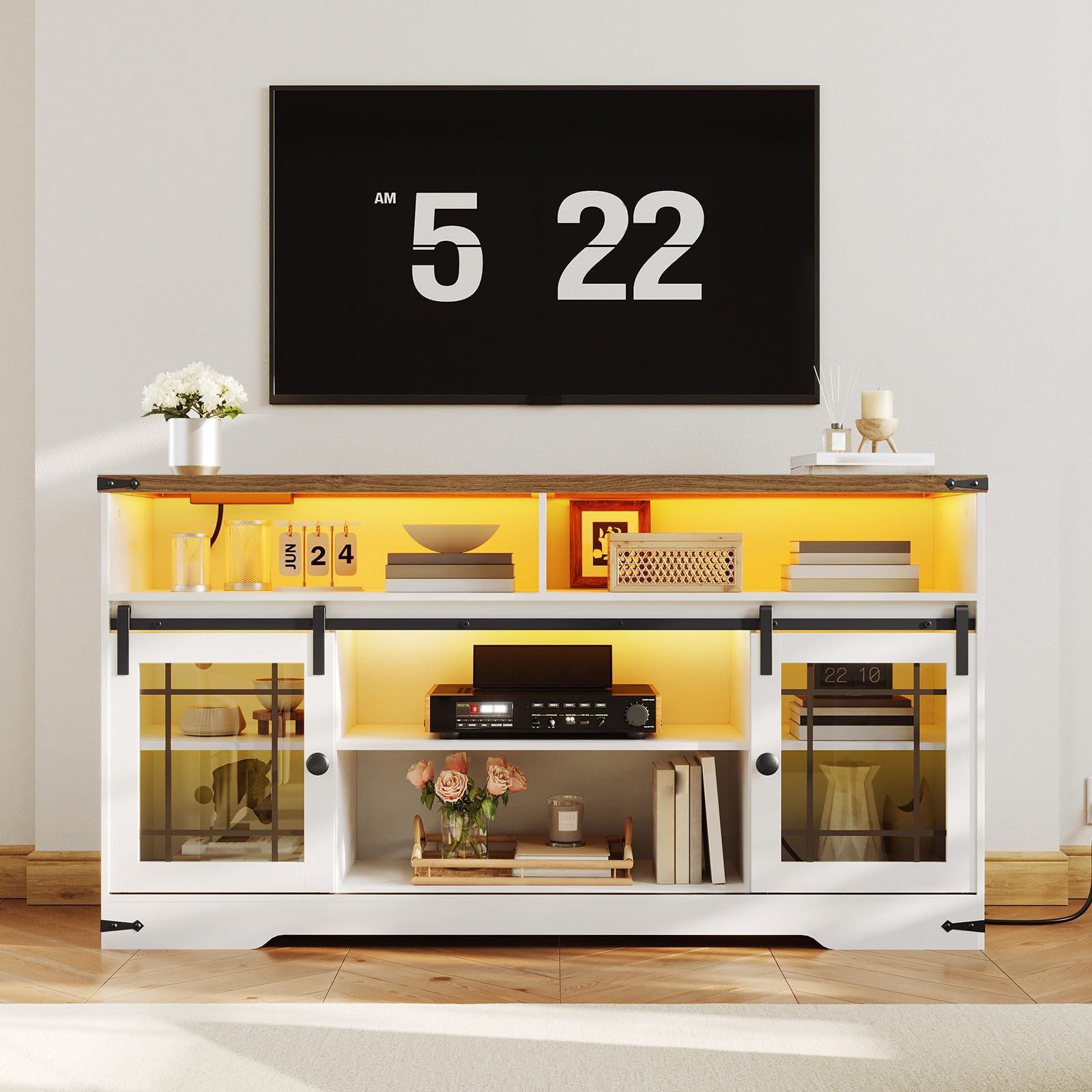 Modern entertainment console with a digital clock display above it in a living room setting.
