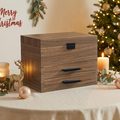 Wooden jewelry box with drawers on a table decorated for Christmas.