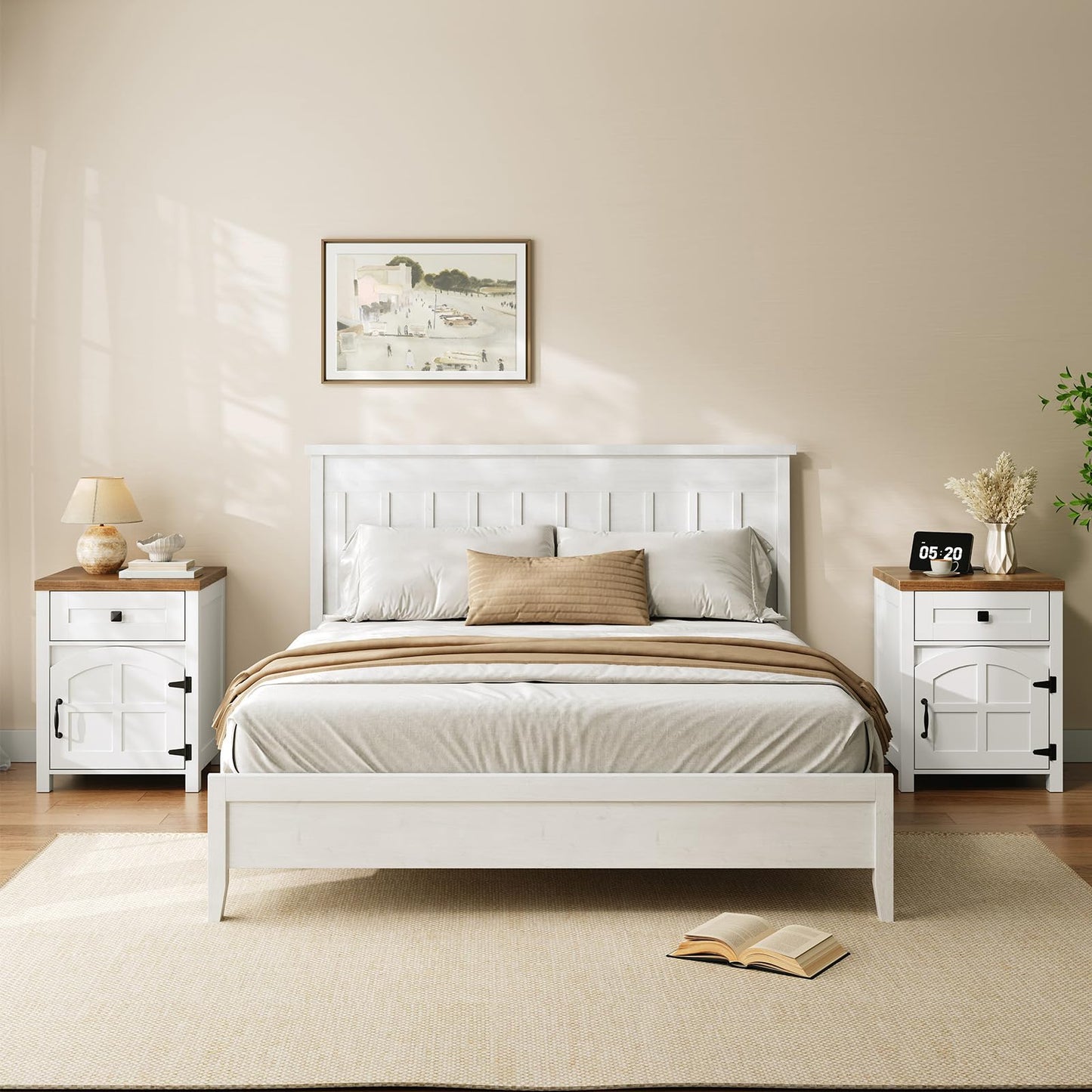 White bedroom with a bed, nightstands, and decor items.