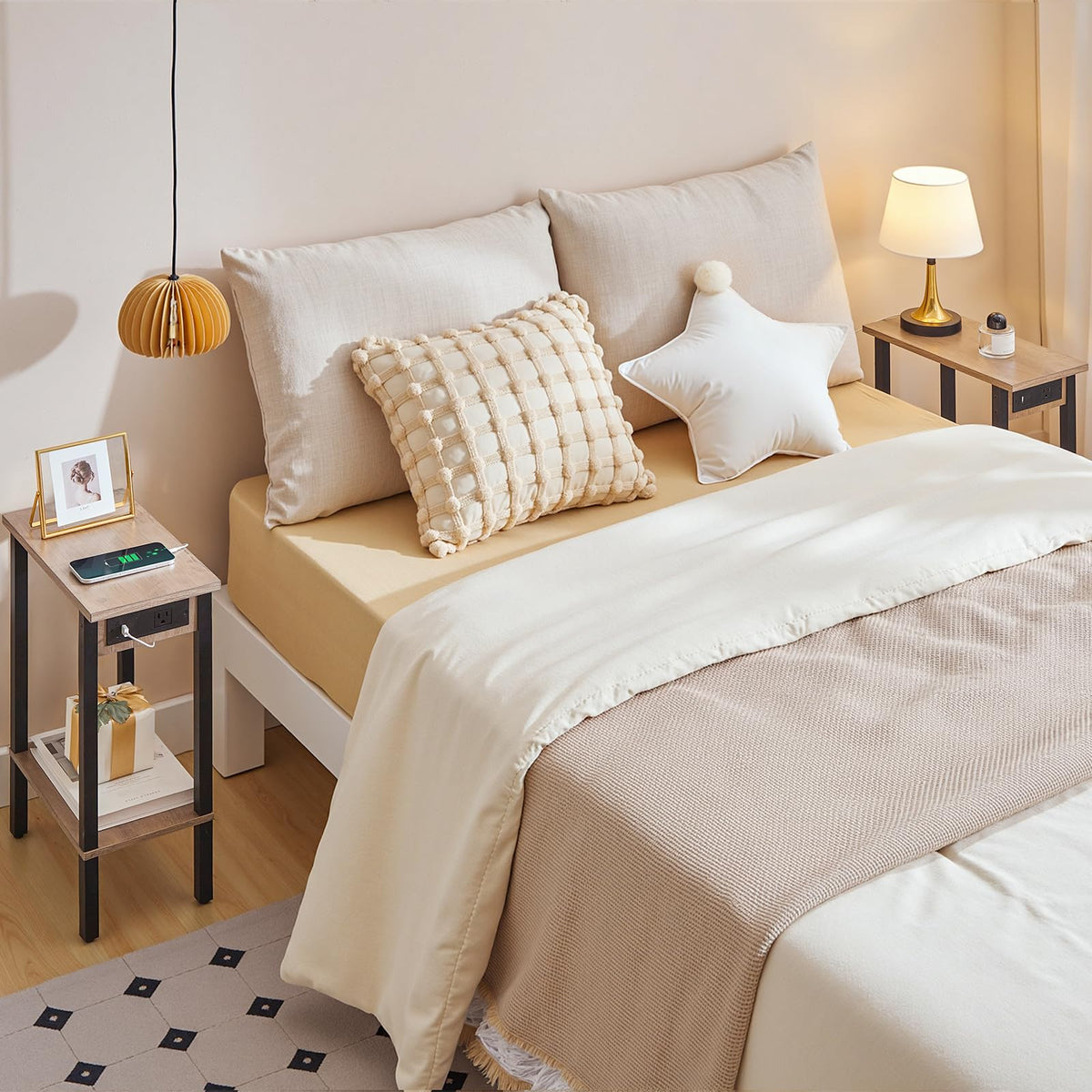 Neatly made bed with beige and white bedding in a bedroom setting.