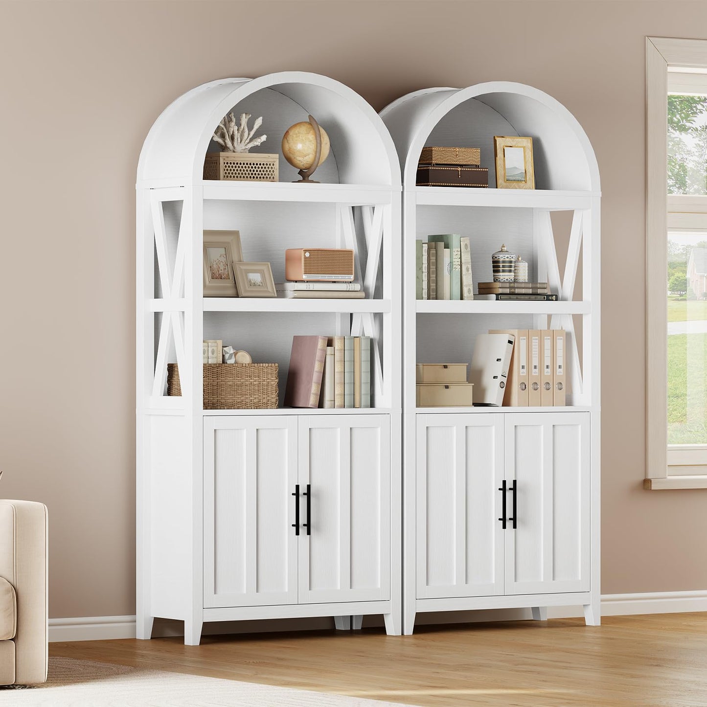 White bookshelves with decorative items against a beige wall.