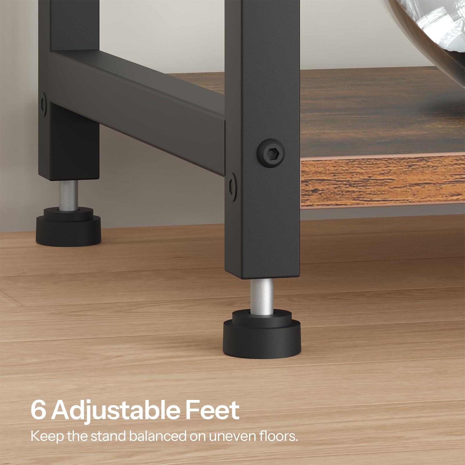 Close-up of a stand with adjustable feet on a wooden floor.