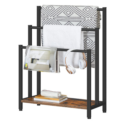Black metal and wooden shelf with books, headphones, and a blanket on a white background