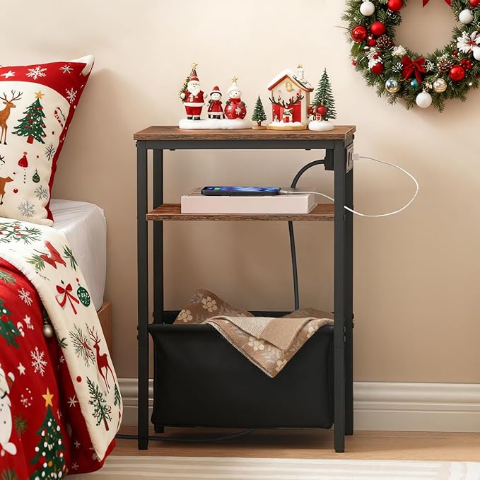 Nighstand with Christmas decor next to a bed with festive bedding.