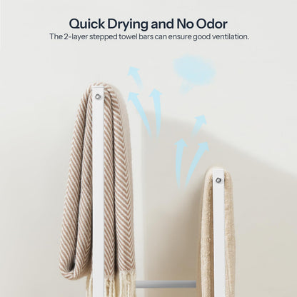 Towel bars with towels hanging on a light gray background, featuring text about quick drying and no odor.