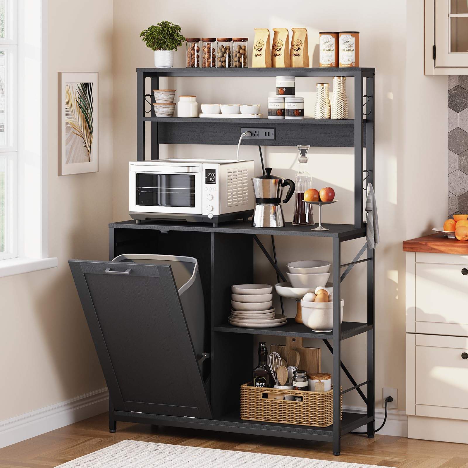 Black kitchen island with shelves, microwave, and various kitchen items in a home setting.